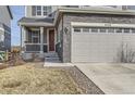Charming two story home with stone accents, attached two-car garage, and welcoming front porch at 4724 S Wenatchee Cir, Aurora, CO 80015