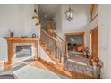 Grand entryway with curved staircase and tile flooring at 3891 Windchant Cir, Castle Rock, CO 80104