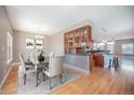 Inviting dining room with hardwood floors flowing into modern kitchen at 4225 W 30Th Ave, Denver, CO 80212
