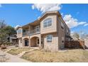 Charming two-story home boasting a lovely facade, balcony and neat yard under blue sky at 4225 W 30Th Ave, Denver, CO 80212