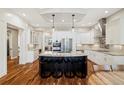 Modern kitchen boasts stainless steel appliances, granite countertops, a central island, and custom cabinetry at 4193 W 99Th Ct, Westminster, CO 80031