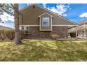 Exterior view of the home showcasing the siding and landscaping at 5316 S Jellison St, Littleton, CO 80123