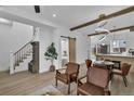 Spacious open living room with a barn door leading to the bedroom and view of the kitchen at 512 W 8Th Ave, Denver, CO 80204