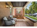 Relaxing front porch featuring a swing and comfortable seating at 1260 Adams St, Denver, CO 80206