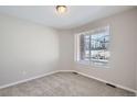 Bright bedroom with plush carpet, natural light, and neutral color palette at 8321 Mount Kataka St, Littleton, CO 80125