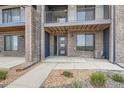 Modern townhome exterior with a covered porch and well-maintained landscaping, offering curb appeal at 8321 Mount Kataka St, Littleton, CO 80125