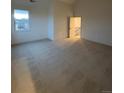 Spacious carpeted bedroom with ample natural light from a large window at 5626 W 142Nd Ave, Broomfield, CO 80020