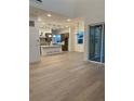 Open-concept living area with hardwood floors and sliding doors to outdoor at 5626 W 142Nd Ave, Broomfield, CO 80020