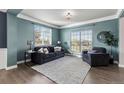 Cozy living room featuring a neutral color palette, large windows, and plush seating at 11522 Trona Ct, Parker, CO 80138