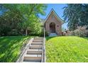 Charming brick home with a well-maintained lawn and mature trees offering shade and curb appeal at 1278 Dexter St, Denver, CO 80220