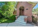 Close up view of the brick front porch with classic design elements and address display at 1278 Dexter St, Denver, CO 80220