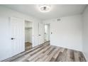 Bright main bedroom with new floors, closet, ensuite, and crisp white paint and trim at 956 S Peoria St, Aurora, CO 80012