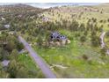 Aerial view of a home nestled within a lush, green landscape at 3021 N Lakeridge Trl, Boulder, CO 80302