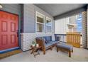 Inviting front porch with comfortable seating, perfect for relaxing and enjoying the outdoors at 8517 Eckley St, Littleton, CO 80125