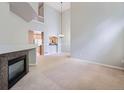Spacious living room with a fireplace and an open floor plan, perfect for entertaining at 5155 W Quincy Ave # J103, Denver, CO 80236