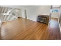 Spacious living room with hardwood floors and a fireplace at 2354 S Troy St, Aurora, CO 80014