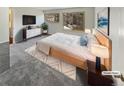Main bedroom with large windows and a modern dresser at 2354 S Troy St, Aurora, CO 80014
