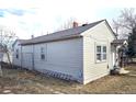 Side view of home showing siding, windows, roofline, and ladder resting against the building at 914 La Farge Ave, Louisville, CO 80027