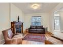 Cozy living room features a decorative fireplace and comfortable seating arrangement at 1474 Clayton St, Denver, CO 80206
