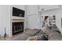 Living room with fireplace, vaulted ceiling, and comfortable seating at 4824 E Kentucky Ave # F, Denver, CO 80246