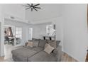 Bright living room features vaulted ceilings, ceiling fan and open floor plan at 4824 E Kentucky Ave # F, Denver, CO 80246