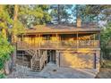 Inviting two-story home featuring a charming covered porch and a convenient two-car garage at 9416 Mcshane Ct, Parker, CO 80134