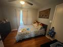 Comfortable bedroom with hardwood floors, soft natural light and ample closet space at 11502 E 7Th E Ave, Aurora, CO 80010