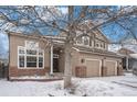 Charming two-story home featuring a two-car garage, brick accents and beautiful landscaping at 13486 Clayton St, Thornton, CO 80241