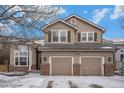 Charming two-story home featuring a two-car garage, brick accents and beautiful landscaping at 13486 Clayton St, Thornton, CO 80241