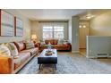 Well-lit living room with modern furnishings, large windows, and inviting decor at 1865 Terry St # 3, Longmont, CO 80501