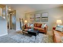 Cozy living room showcasing tasteful artwork, plush sofas, and a decorative rug at 1865 Terry St # 3, Longmont, CO 80501