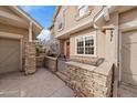 Stone and stucco exterior with a walkway and attached garage at 4231 W 105Th Way, Westminster, CO 80031