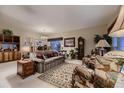 Comfortable living room featuring a variety of seating options and elegant decor at 20510 Oakbrook Ln, Parker, CO 80138