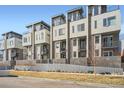 Modern townhomes with balconies and brick accents offer luxury living at 1583 Grove St # 5, Denver, CO 80204