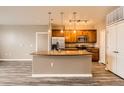 A kitchen with an island and a stainless steel refrigerator at 10176 Park Meadows Dr # 2403, Lone Tree, CO 80124