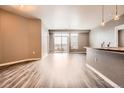 A spacious living room with an open floor plan with luxury vinyl flooring at 10176 Park Meadows Dr # 2403, Lone Tree, CO 80124