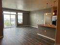 Spacious living room with a sliding glass door that leads to a balcony at 10176 Park Meadows Dr # 2403, Lone Tree, CO 80124