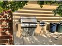 Stainless steel BBQ grill with side burner and extra storage space perfect for outdoor entertaining at 10176 Park Meadows Dr # 2403, Lone Tree, CO 80124