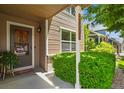 Inviting front porch with decorative plants and a view of the well-maintained neighborhood at 13235 Clermont Cir, Thornton, CO 80241