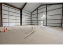 Spacious metal building interior with concrete flooring ready for customization at 14550 Arfsten Rd, Larkspur, CO 80118