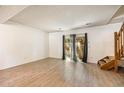 Bright living room with modern flooring, natural light, and access to outdoor space at 1545 S Ouray Cir # B, Aurora, CO 80017