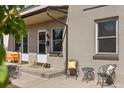 Charming front porch with seating, flowers and curb appeal at 2616 Utica St, Denver, CO 80212
