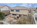 The backyard has a patio with a table and chairs, perfect for enjoying outdoor meals at 12850 Ventana St, Parker, CO 80134