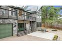 Beautiful home featuring stone accents, two decks, and a welcoming porch area with seating at 7317 Fremont Pl, Larkspur, CO 80118