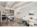 Open floor plan featuring a living room and kitchen area with modern finishes and natural light at 1495 Vrain St # 115, Denver, CO 80204