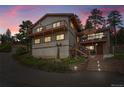 Charming multi-story home featuring two decks, a finished basement, and a separate garage at 9648 Yegge Rd, Morrison, CO 80465