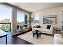 Living room featuring natural light, hardwood floors, sofa, and scenic views at 20 Wilcox St # 410, Castle Rock, CO 80104