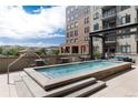 Rooftop pool with seating and scenic views of the city at 20 Wilcox St # 410, Castle Rock, CO 80104