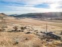 Expansive aerial view of the property showcasing the house, valley, and distant mountains at 208 Wark Ave, Berthoud, CO 80513