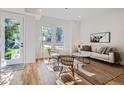 Bright and airy living room with hardwood floors and large windows at 2945 S Elati St, Englewood, CO 80110
